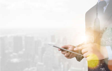 Business Digital businessman hand working on laptop computer and business strategyの写真素材