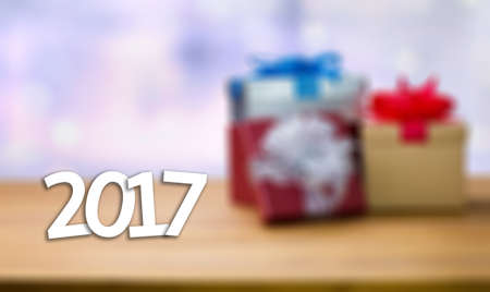 2017 Happy New Year Holiday on blur bokeh and box background with christmas ball star snowflake...
