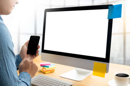 man of business man hand working on laptop computer on wooden desk Laptop with blank screen on table.の写真素材