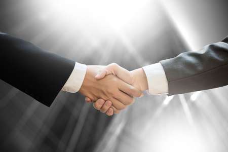 businessman handshake Professional Business partnership meeting concept  Silhouette and filter sunの写真素材