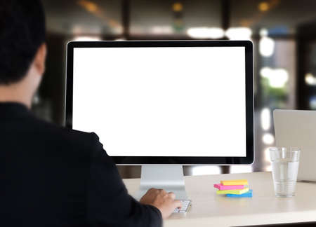 young man working Businessman using a desktop computer of the blank screenの写真素材