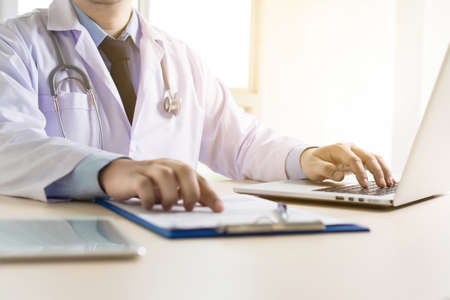 Doctor and patient are discussing something, just hands talk doctor reassuring her patientの写真素材
