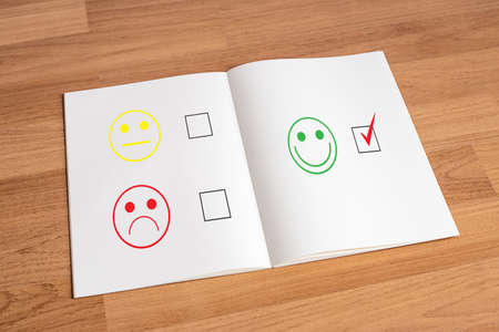 business man and woman select happy on satisfaction evaluation? And good mood smileyの写真素材