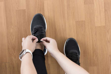 Female fitness exercise concept Fit woman stretching her leg to warm up Happy young fitness womanの写真素材