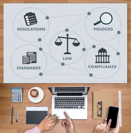 REGULATIONS and COMPLIANCE Rules Law professionals businessman working conceptの写真素材