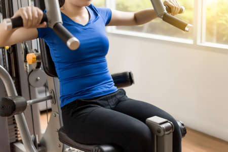 woman fitness  workout use dumbbell in Closeup on fitness training Strong Female fitness exercise...