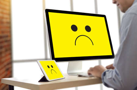 Depressive emotions concept,   smiley face emoticon printed depression and sad pessimistic face sadnessの写真素材