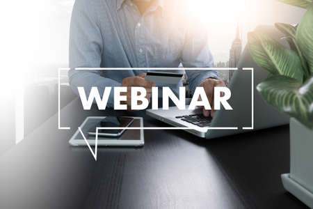 WEBINAR hand on table use E-business Browsing Connection in computer, coffee, Split toneの写真素材