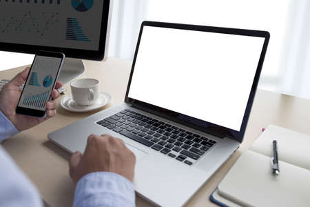 Laptop with blank screen on table.
