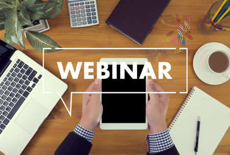 WEBINAR hand on table use E-business Browsing Connection in computer, coffee, Split toneのeditorial素材