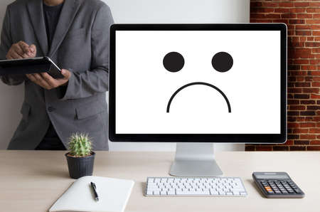 Depressive emotions concept,   smiley face emoticon printed depression and sad pessimistic face sadnessのeditorial素材