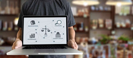 REGULATIONS and COMPLIANCE Rules Law professionals businessman working conceptの写真素材