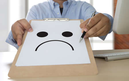 Depressive emotions concept,   smiley face emoticon printed depression and sad pessimistic face...