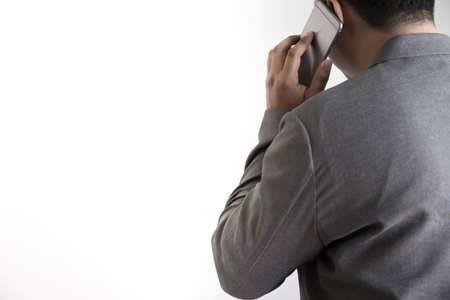 man use phone happy and  smile with coffee and White background copy spaceの写真素材