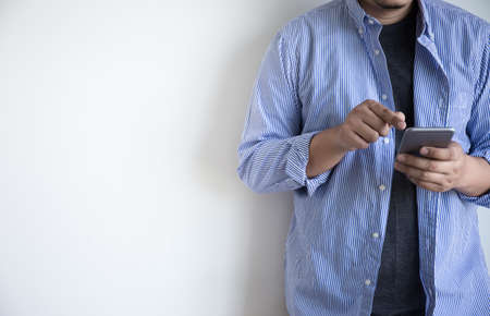 man use phone happy and  smile with coffee and White background copy spaceの写真素材