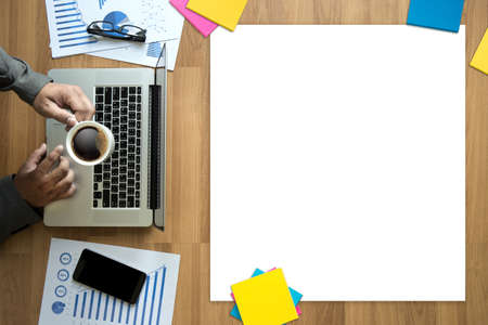 Top view man used of laptop  hands on a wooden desktop and copy spaceの写真素材