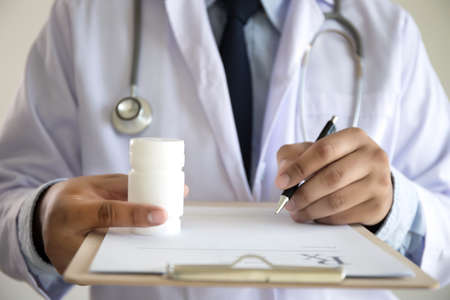 medicine doctor patient healthcare concept contraception Rx prescription form in drug store Pharmacist pharmacyの写真素材