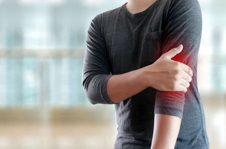 young man Feeling suffering  Lower back pain  Pain relief conceptの写真素材