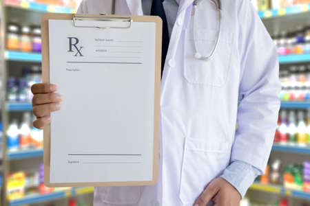 medicine doctor patient healthcare concept contraception Rx prescription form in drug store Pharmacist pharmacyの写真素材