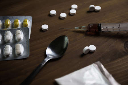 man substance dependence medication Drug syringe and cooked heroinの写真素材