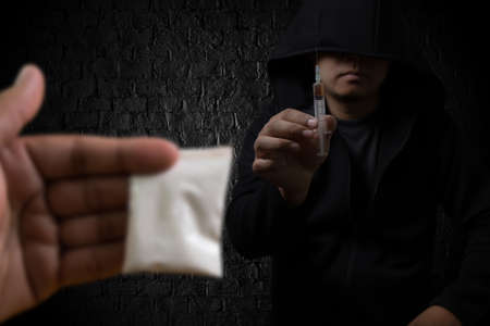 man substance dependence medication Drug syringe and cooked heroinの写真素材