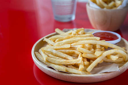 Fresh Potatoes Tasty french fries with ketchup fast food productsの写真素材