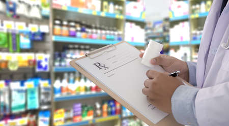 medicine doctor patient healthcare concept contraception Rx prescription form in drug store Pharmacist pharmacyの写真素材