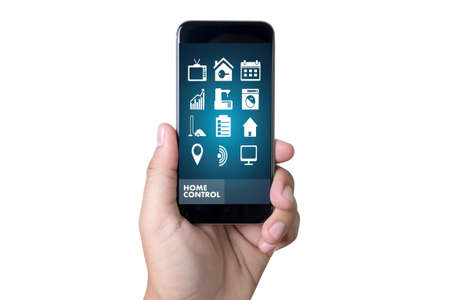 A home system remote control on a smartphone, Real estate conceptの写真素材