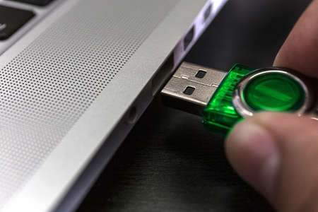 USB flash cards and thumb drive or stick Virtual memory storage with USB cable into slot  laptop...