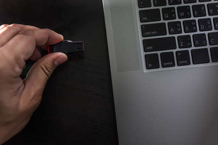 USB flash cards and thumb drive or stick Virtual memory storage with USB cable into slot  laptop...