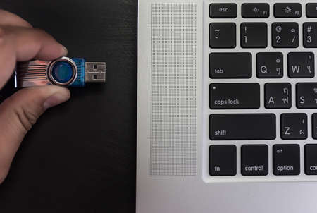 USB flash cards and thumb drive or stick Virtual memory storage with USB cable into slot  laptop...