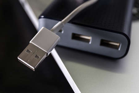 USB flash cards and thumb drive or stick Virtual memory storage with USB cable into slot  laptop computerの写真素材