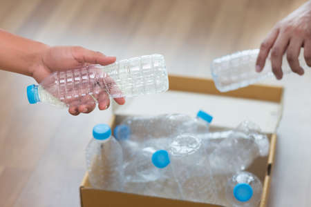 man hand putting plastic reuse  for recycling concept environmental protection world recycle