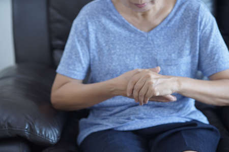 arthritis old person and Elderly woman female suffering from pain at home