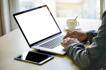 Workspace background new project on laptop computer with blank copy space screen for your advertising text message Laptop with blank screen on table.の写真素材