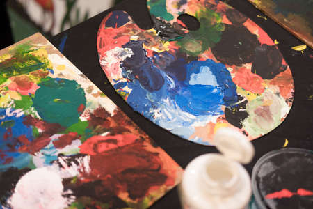 Used paint brushes with watercolor set Old paint cans and colors colorful and paint brush.の写真素材