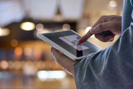 Man touch tablet, laptop connecting wifi technology business people work spaceの写真素材