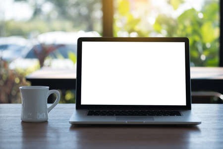 Laptop with blank screen on table. Workspace background new project on laptop computer with blank...