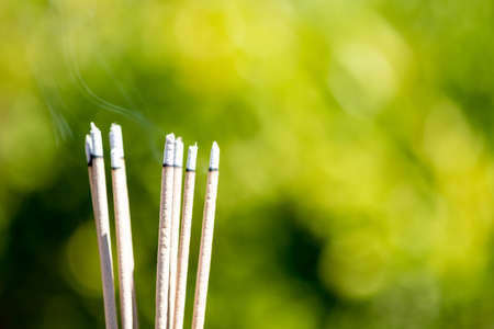 burning Embossed  sticks and smoke from incense burning and smokeの写真素材