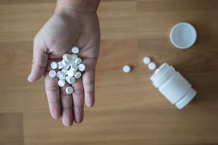 pills and medicines in the hand pharmaceutical medicine pharmacyの写真素材