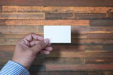 Hand hold blank white card mockup Business branding.の写真素材