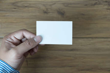 Hand hold blank white card mockup Business branding.の写真素材
