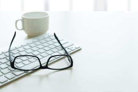 Close up of glasses and computer  business workplace work place in officeの写真素材