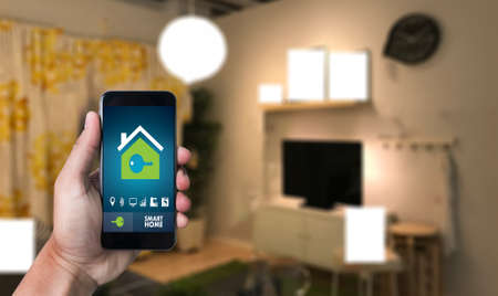 Internet of things   iot  Remote home control to modern living room system on phoneの写真素材