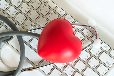 Red heart and a stethoscope Medical Equipment Healthcare medical insuranceの写真素材