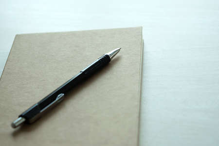 Top view of businessman  blank notebook business document black penの写真素材