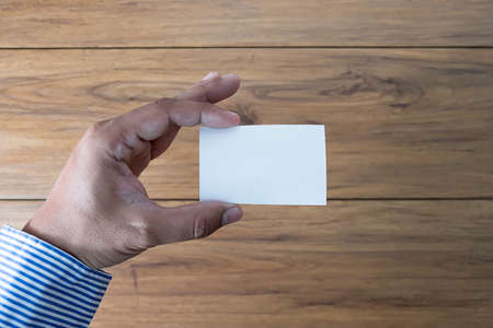 Hand hold blank white card mockup Business branding.の写真素材