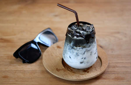 Iced coffee cafe latte in white coffee beans Delicious coffee with ice