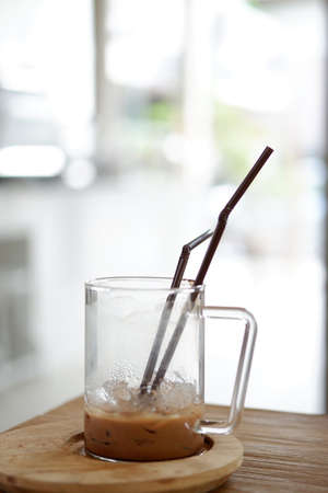 Iced coffee cafe latte in white coffee beans Delicious coffee with iceの写真素材