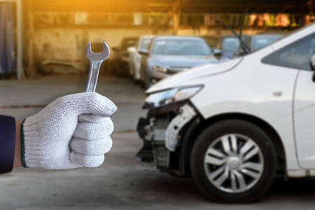 Mechanic repairing a car  in garage  Auto repair car engineの写真素材